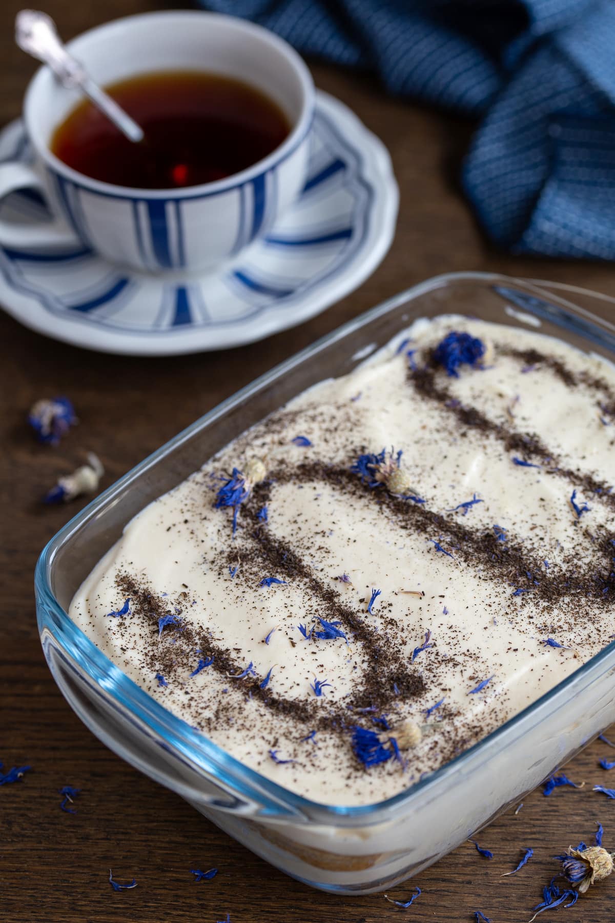 Earl Grey tiramisu topped with powdered tea and cornflower petals.