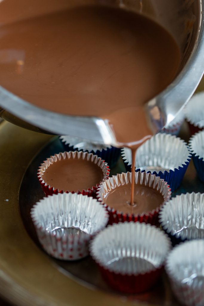 Pouring mixture into tinfoil molds.