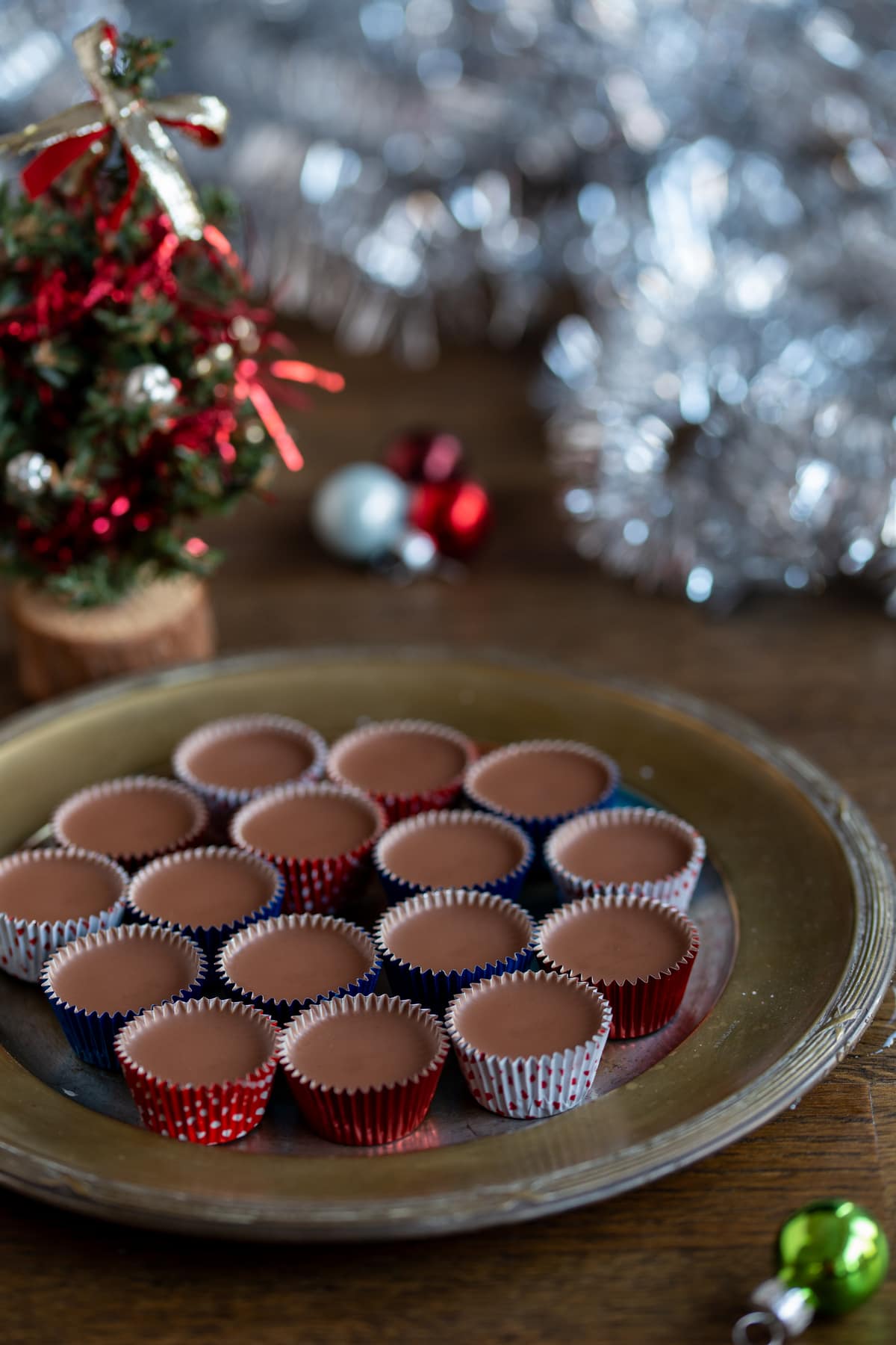 Swedish Christmas chocolate pralines next to Christmas ornaments.