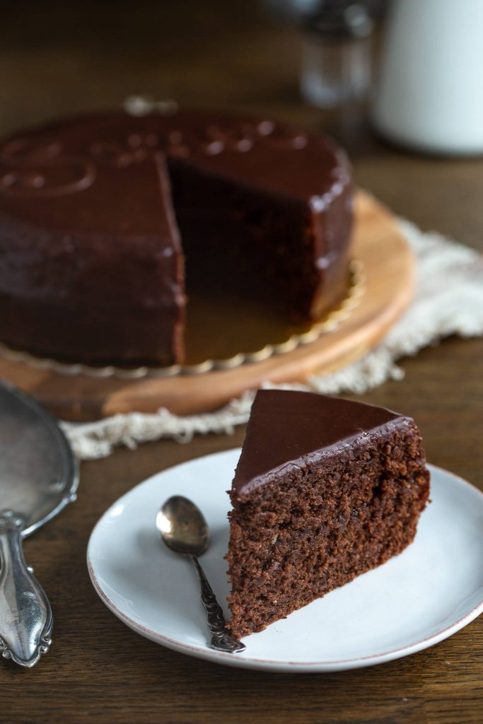 Sacher torte sliced on a plate.