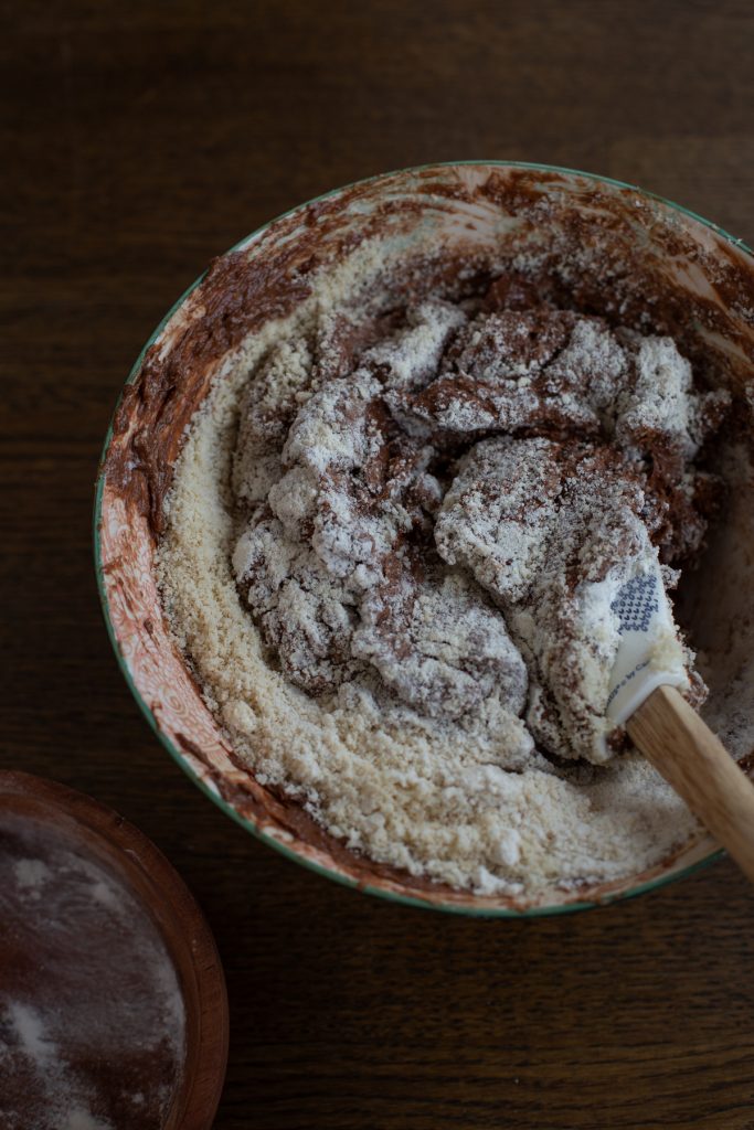 Folding dry ingredients into batter.
