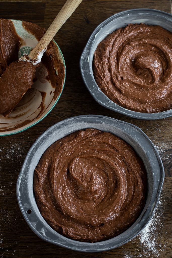 Cake batter divided into 2 pans.