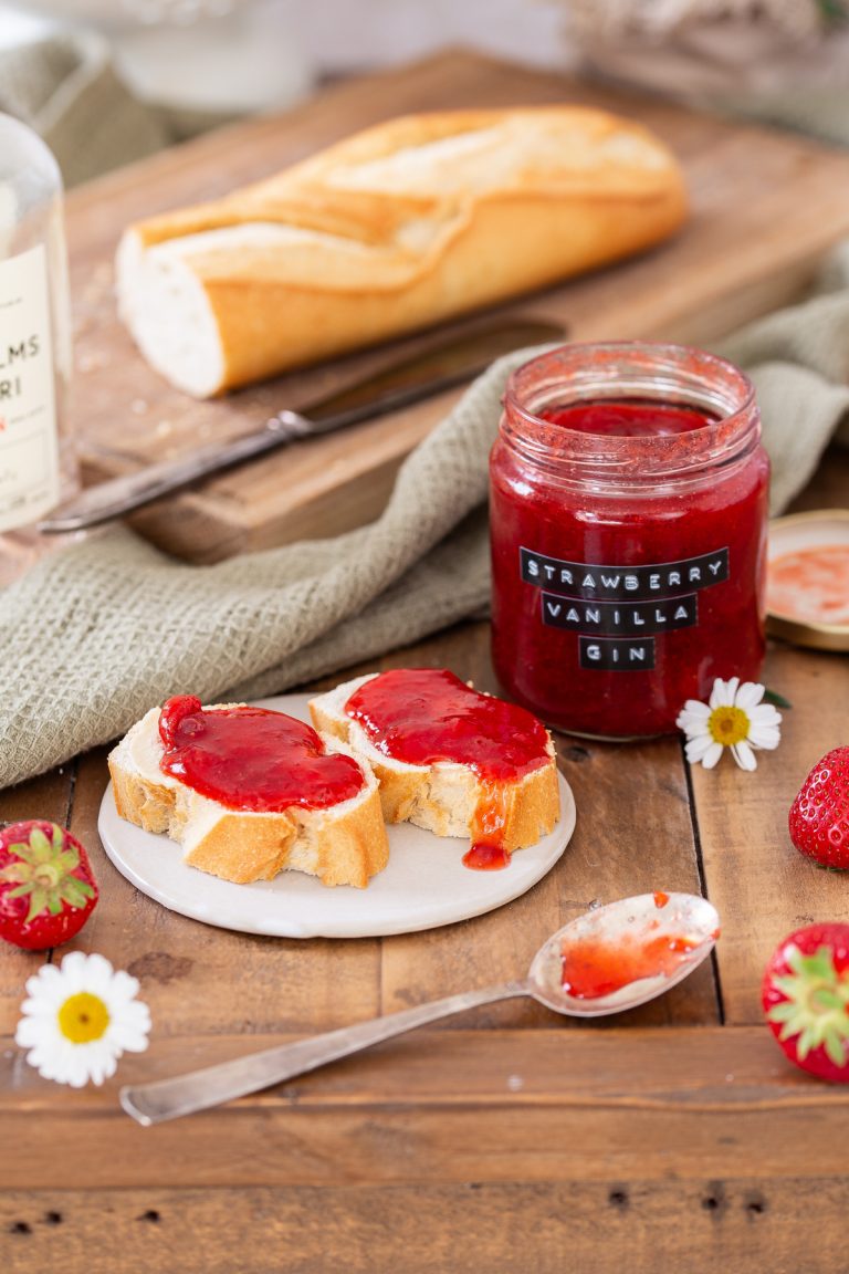 Strawberry and gin jam in a jar and on bread.