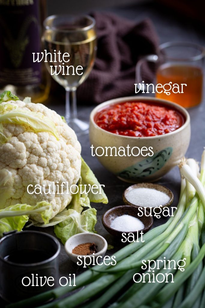 The ingredients needed for tomato pickled cauliflower.