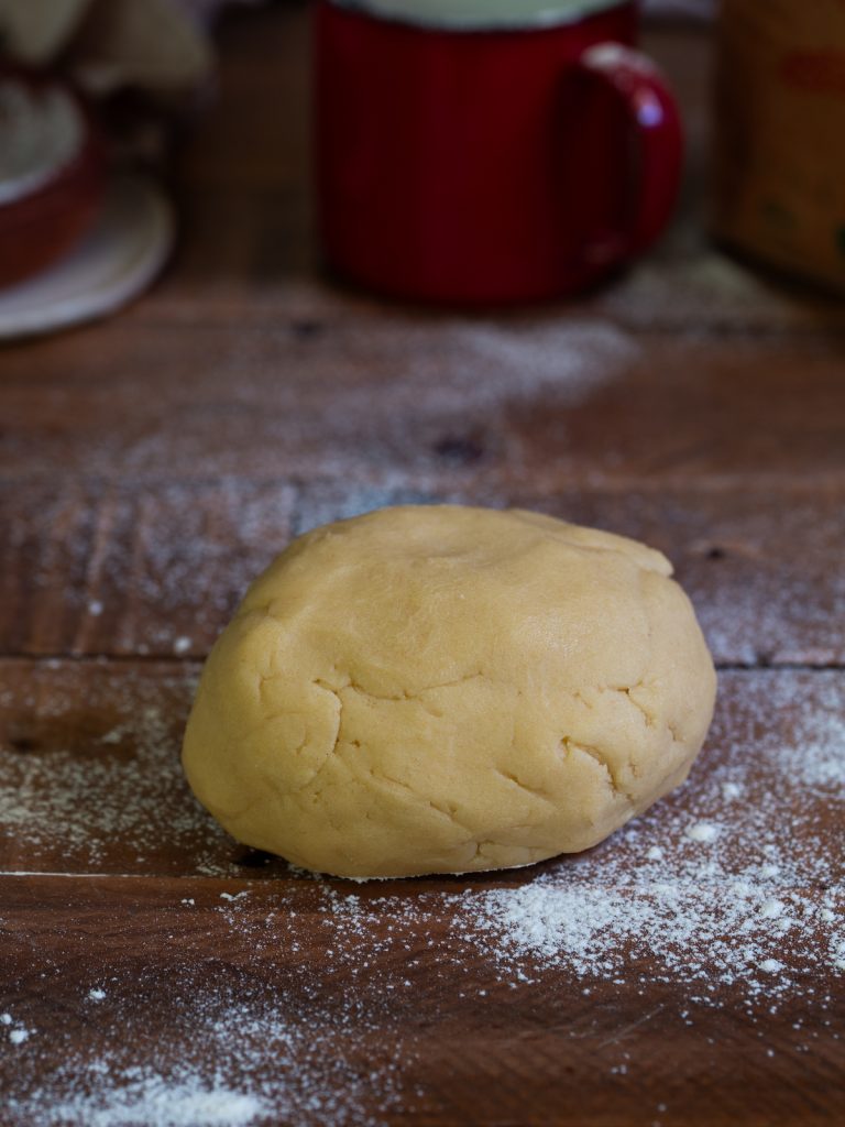 A ball of sweet shortcrust pastry dough.