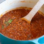Le Creuset pot filled with vegetable ragu.