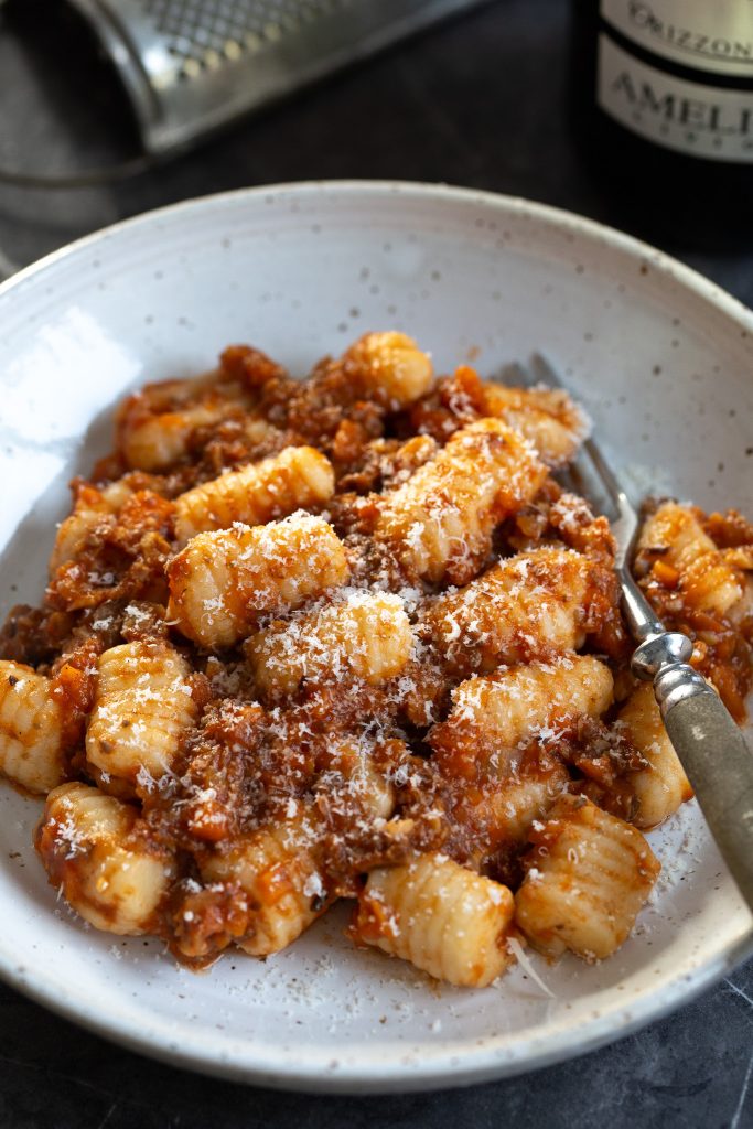 Fresh gnocchi served with vegan ragu made with hazelnuts and mushrooms.