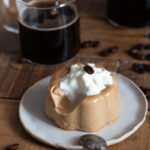 Panna cotta with a spoonful missing to show texture.
