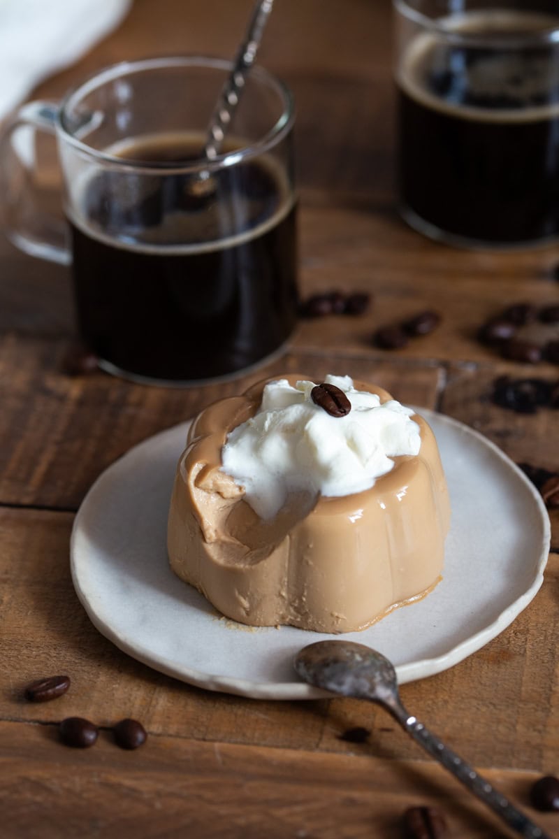 Panna cotta with a spoonful missing to show texture.