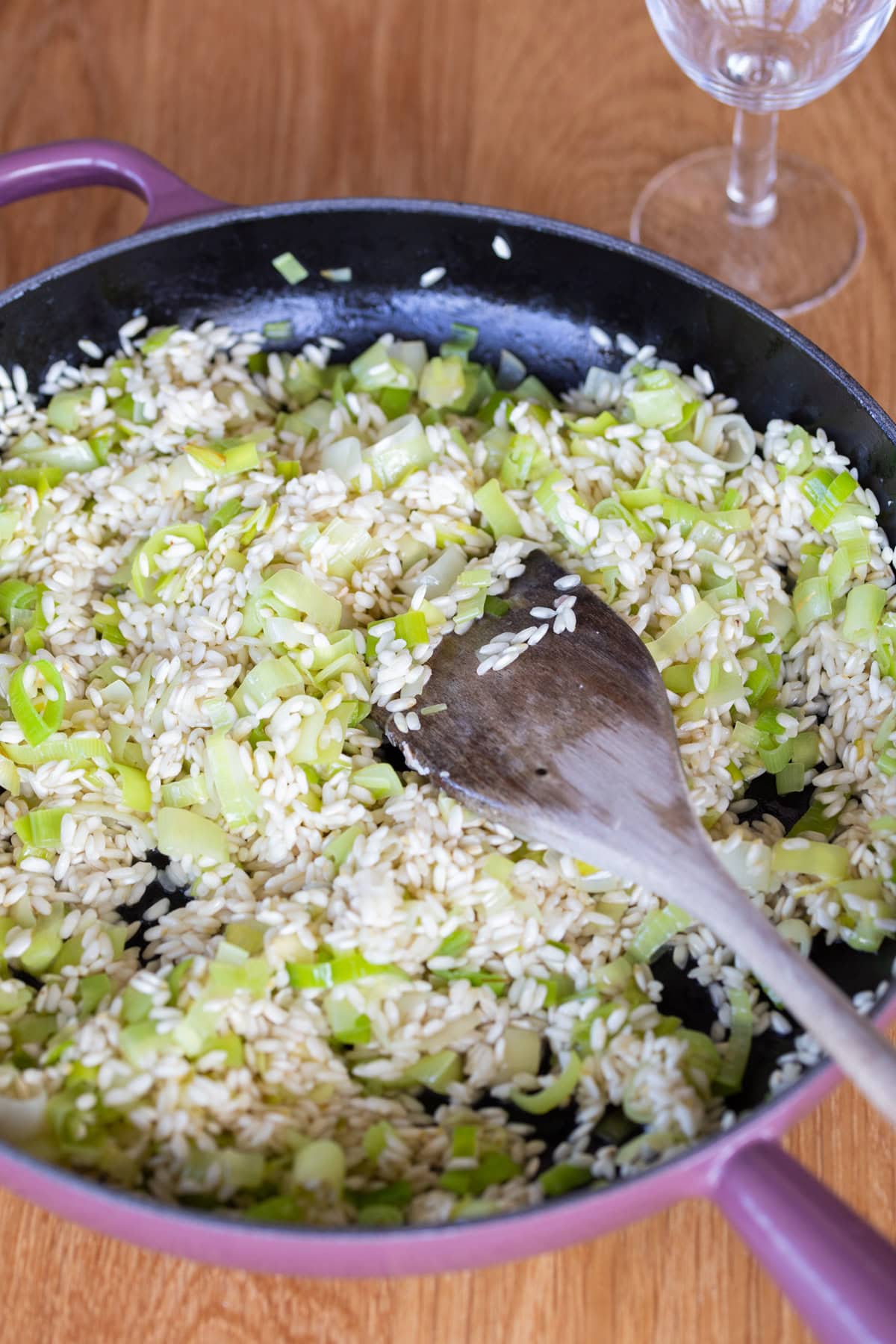 Sauteed risotto rice and leeks.