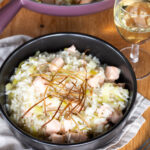 Salmon risotto with fried leek topping.