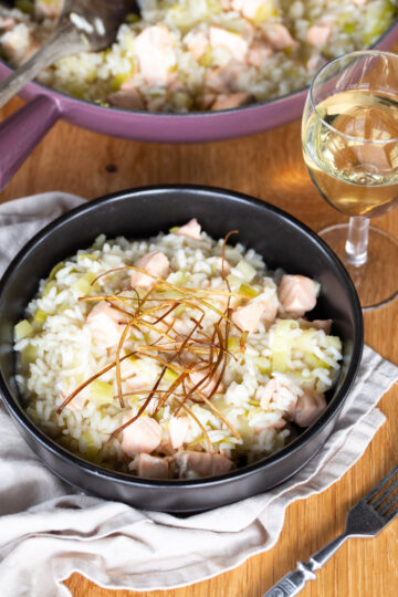 Salmon risotto with fried leek topping.