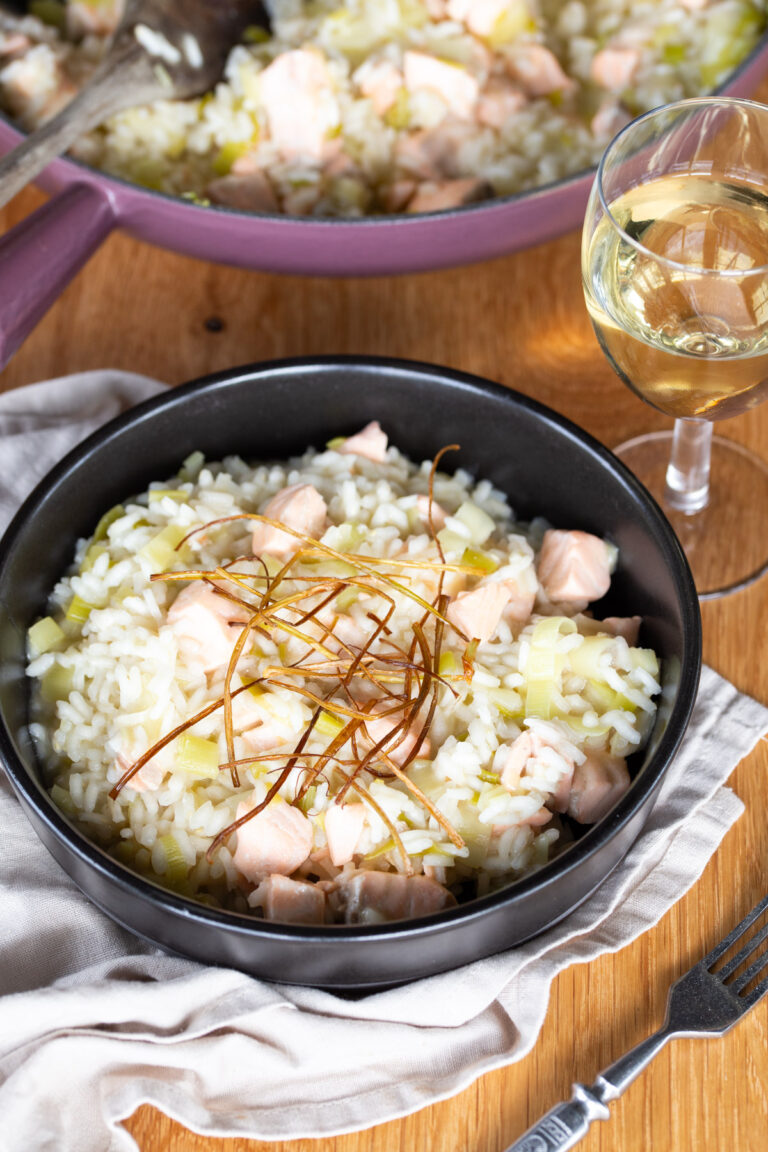 Salmon risotto with fried leek topping.
